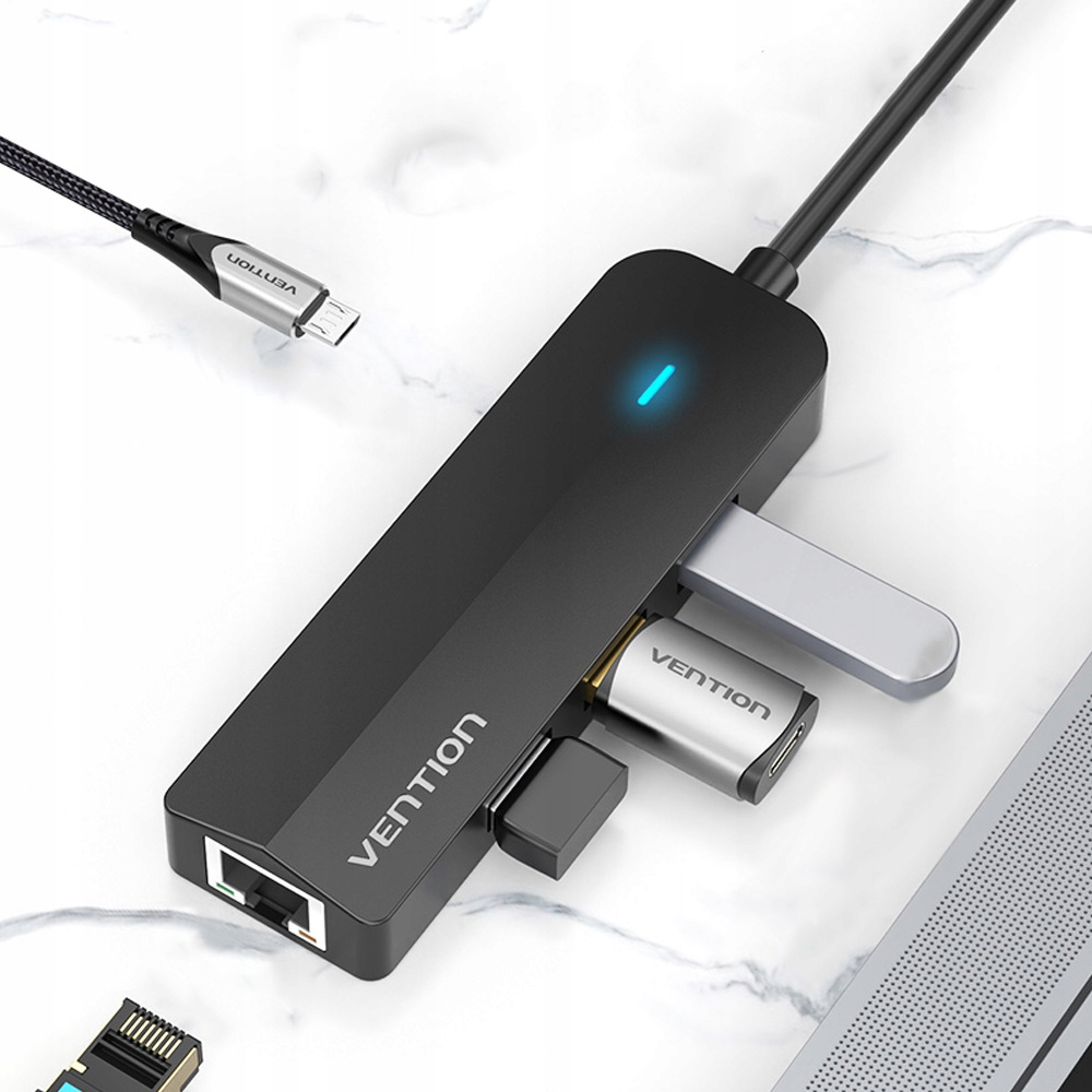 # Vention USB-C to 3x USB 3.0 + RJ45 + Micro-B Hub 0.15M Black ABS Type (TGPBB) **Focus keyphrase:** Vention USB-C to 3x USB 3.0 RJ45 Hub TGPBB **Meta description:** Vention USB-C to 3x USB 3.0 + RJ45 Hub (TGPBB) — 5Gbps USB 3.0 ports, Gigabit Ethernet, and a Micro-B power input in a compact ABS design. **Note:** alongside the 3x USB 3.0 and RJ45 ports named in the product title, this hub also includes a **Micro-B port for optional power input**, so the description below covers all five ports the manufacturer lists. The Vention USB-C to 3x USB 3.0 + RJ45 Hub 0.15M Black (TGPBB) turns a single **USB-C port** into **three USB 3.0 ports and one Gigabit Ethernet port**, so a laptop with limited connectivity can reach external drives, peripherals, and a wired network at once. It delivers **data transfer speeds of up to 5Gbps** across its USB 3.0 ports, and, as a result, handles external hard drives, flash drives, and other peripherals without a noticeable bottleneck. In addition, its **RJ45 port supports up to 1000Mbps**, which adds a stable wired connection for streaming, gaming, or video calls without relying on Wi-Fi. Furthermore, a **Micro-B port allows optional power input**, so the hub can draw extra power when several devices are connected at once. Its compact **ABS shell** and short **0.15-meter cable** keep the whole unit easy to carry, and it works on a **plug-and-play basis** with no drivers required. ## Key Features In short, this hub stands out in five areas: - **3x USB 3.0 ports**, which, in turn, deliver up to 5Gbps for external drives, flash drives, and other peripherals - **Gigabit Ethernet (RJ45) port**, supporting up to 1000Mbps for a stable wired network connection - **Micro-B power input port**, so the hub can draw extra power when running multiple connected devices - **Plug-and-play design**, requiring no drivers on Windows, macOS, or Linux - **Compact ABS shell** with a short 0.15-meter cable, for a portable, travel-friendly hub ## Technical Specifications Specifically, the table below details every core specification of this hub: | Specification | Details | | --- | --- | | Model | Vention TGPBB | | Host Connector | USB-C male | | Output Ports | 3x USB 3.0 Type-A female, 1x RJ45 female, 1x Micro-B female (power input) | | USB 3.0 Data Transfer Rate | Up to 5Gbps | | Ethernet Speed | Up to 1000Mbps (10/100/1000) | | Power Input | Optional, via Micro-B port | | Shell Material | ABS plastic | | Cable Length | 0.15 meters | | Color | Black | | Plug and Play | Yes, no drivers required | | Certification | CE, FCC, RoHS | | OS Compatibility | Windows, macOS, Linux | ## Who This Hub Is Best Suited For As a result of this combination of ports and build quality, three types of users benefit most: - **USB-C laptop users with limited ports**, who need extra USB 3.0 connections and a wired network link from a single USB-C port - **Professionals working from unstable Wi-Fi**, since the Gigabit Ethernet port offers a more reliable connection for video calls and large file transfers - **Anyone connecting multiple peripherals at once**, thanks to the Micro-B power input that keeps the hub stable when several devices draw power simultaneously - Ivonix # Vention USB-C to 3x USB 3.0 + RJ45 + Micro-B Hub 0.15M Black ABS Type (TGPBB) **Focus keyphrase:** Vention USB-C to 3x USB 3.0 RJ45 Hub TGPBB **Meta description:** Vention USB-C to 3x USB 3.0 + RJ45 Hub (TGPBB) — 5Gbps USB 3.0 ports, Gigabit Ethernet, and a Micro-B power input in a compact ABS design. **Note:** alongside the 3x USB 3.0 and RJ45 ports named in the product title, this hub also includes a **Micro-B port for optional power input**, so the description below covers all five ports the manufacturer lists. The Vention USB-C to 3x USB 3.0 + RJ45 Hub 0.15M Black (TGPBB) turns a single **USB-C port** into **three USB 3.0 ports and one Gigabit Ethernet port**, so a laptop with limited connectivity can reach external drives, peripherals, and a wired network at once. It delivers **data transfer speeds of up to 5Gbps** across its USB 3.0 ports, and, as a result, handles external hard drives, flash drives, and other peripherals without a noticeable bottleneck. In addition, its **RJ45 port supports up to 1000Mbps**, which adds a stable wired connection for streaming, gaming, or video calls without relying on Wi-Fi. Furthermore, a **Micro-B port allows optional power input**, so the hub can draw extra power when several devices are connected at once. Its compact **ABS shell** and short **0.15-meter cable** keep the whole unit easy to carry, and it works on a **plug-and-play basis** with no drivers required. ## Key Features In short, this hub stands out in five areas: - **3x USB 3.0 ports**, which, in turn, deliver up to 5Gbps for external drives, flash drives, and other peripherals - **Gigabit Ethernet (RJ45) port**, supporting up to 1000Mbps for a stable wired network connection - **Micro-B power input port**, so the hub can draw extra power when running multiple connected devices - **Plug-and-play design**, requiring no drivers on Windows, macOS, or Linux - **Compact ABS shell** with a short 0.15-meter cable, for a portable, travel-friendly hub ## Technical Specifications Specifically, the table below details every core specification of this hub: | Specification | Details | | --- | --- | | Model | Vention TGPBB | | Host Connector | USB-C male | | Output Ports | 3x USB 3.0 Type-A female, 1x RJ45 female, 1x Micro-B female (power input) | | USB 3.0 Data Transfer Rate | Up to 5Gbps | | Ethernet Speed | Up to 1000Mbps (10/100/1000) | | Power Input | Optional, via Micro-B port | | Shell Material | ABS plastic | | Cable Length | 0.15 meters | | Color | Black | | Plug and Play | Yes, no drivers required | | Certification | CE, FCC, RoHS | | OS Compatibility | Windows, macOS, Linux | ## Who This Hub Is Best Suited For As a result of this combination of ports and build quality, three types of users benefit most: - **USB-C laptop users with limited ports**, who need extra USB 3.0 connections and a wired network link from a single USB-C port - **Professionals working from unstable Wi-Fi**, since the Gigabit Ethernet port offers a more reliable connection for video calls and large file transfers - **Anyone connecting multiple peripherals at once**, thanks to the Micro-B power input that keeps the hub stable when several devices draw power simultaneously